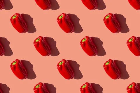 Seamless pattern of a photo of a ripe red bulgarian pepper on a pink backgrou Stock-Fotos