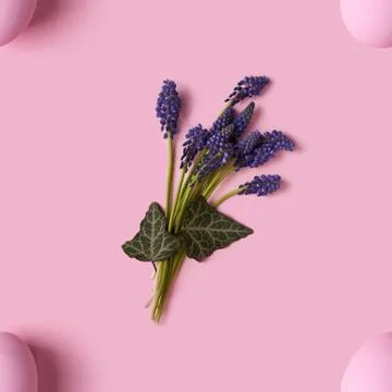 Seamless pattern of pink Easter eggs and spring flovers over pink background 스톡 사진