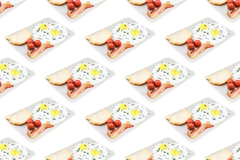 Seamless pattern from plates with breakfast on a white background Stock Photos