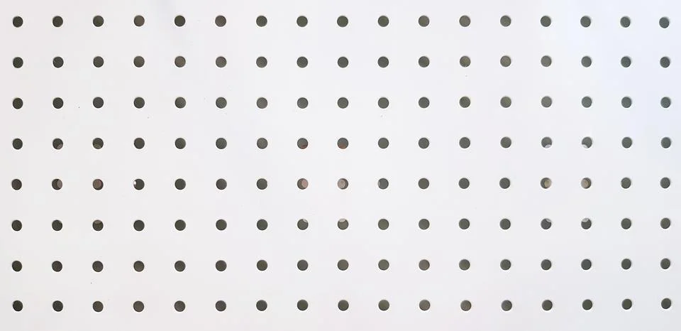 Seamless pattern of polka dot on white stainless steel for background. Stock Photos
