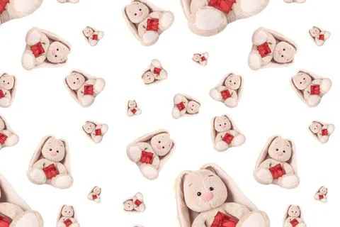 Seamless pattern with a rabbit and a red gift. Stockfoto's