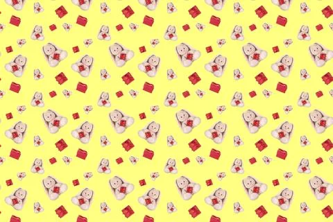 Seamless pattern with a rabbit and a red gift. Stock Photos