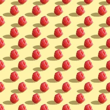 Seamless pattern of raspberry berries on a yellow background. 스톡 사진