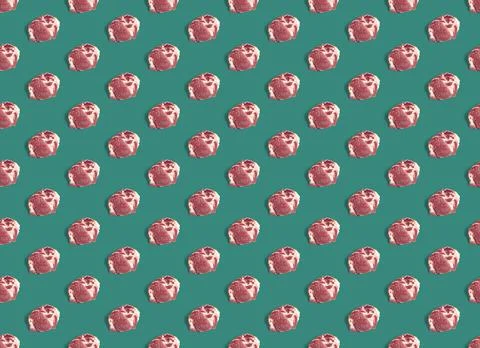 Seamless Pattern with raw pork meat slices on green background, food pattern Stock Photos