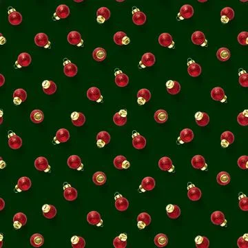 Seamless pattern with red Christmas decorations on greemnbackground. Christma Stock Photos