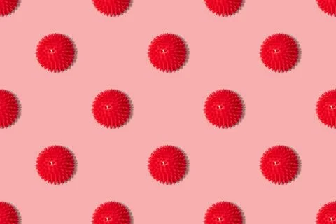 Seamless pattern with red coronavirus molecules on a pink background. Covid Stock Photos