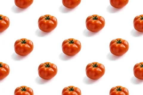 Seamless pattern with red fresh tomatoes on a white background with hard light Stock Photos