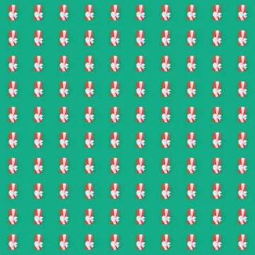 Seamless pattern with red gift box over the green background Stock Photos