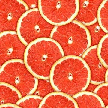 Seamless pattern of red grapefruit slices Stock Photos