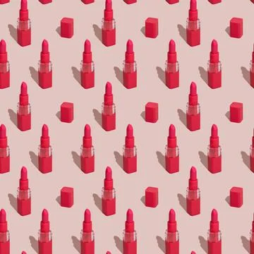 Seamless pattern of red lipstick and caps on pink background. Red lipstick in Stock Photos
