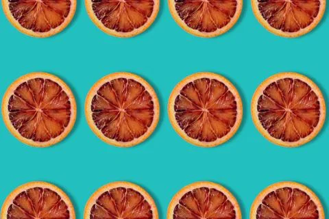 Seamless pattern of red orange on blue background, abstract fruit summer back Stock Photos