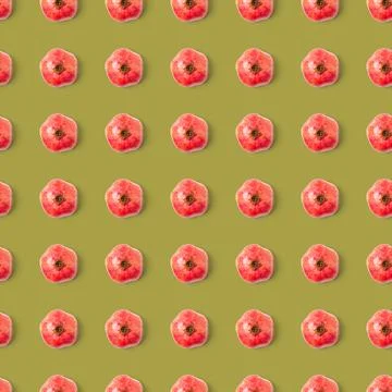 Seamless pattern with red pomegranate fruit on mustard color blackground Stock Photos