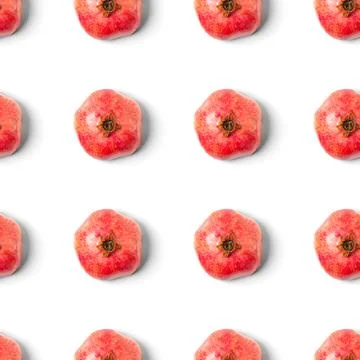 Seamless pattern with red pomegranate fruit on blue background. Minimal flat lay Foto stock