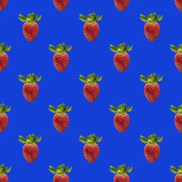 Seamless pattern with red strawberries on blue Stock Photos