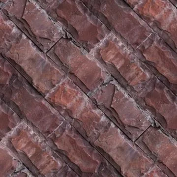 Seamless pattern of red wall from natural stone bricks. Stock Photos