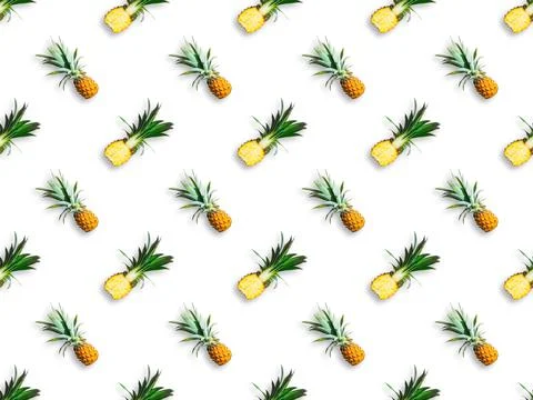 Seamless pattern of ripe pineapples isolated on white background. Top view Stock Photos