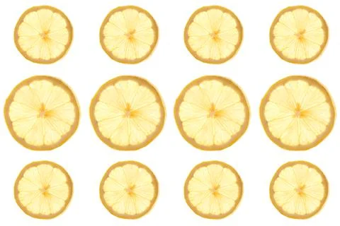 Seamless pattern of round transparent slices of ripe juicy yellow lemon on a 写真素材
