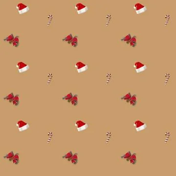 Seamless pattern Santa hat, bow and candy cane candy cane on brown background Stock Photos