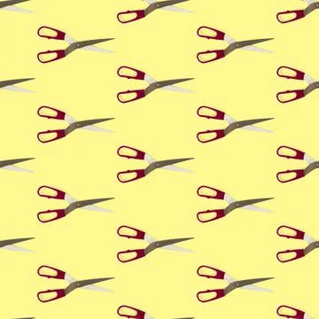 Seamless pattern of scissors separated from the yellow flat layer. Scissors with Foto stock
