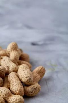 Seamless pattern shelled peanuts isolated on white background, top view, close Stock Photos