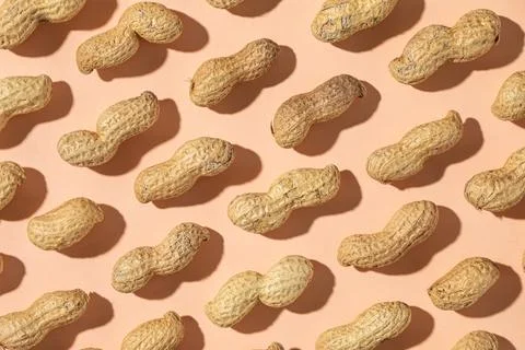 Seamless pattern of shelled peanuts Stock Photos