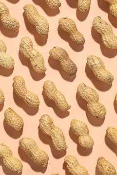 Seamless pattern of shelled peanuts Stock Photos