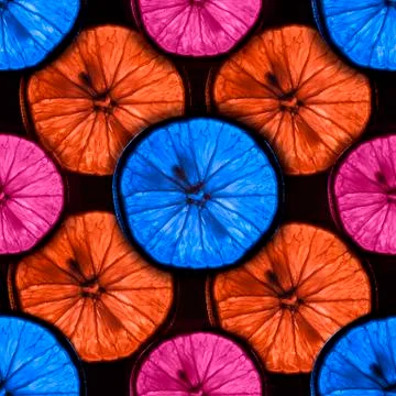 Seamless pattern of slices of multicolor citrus fruit with backlight isolated Stock Photos