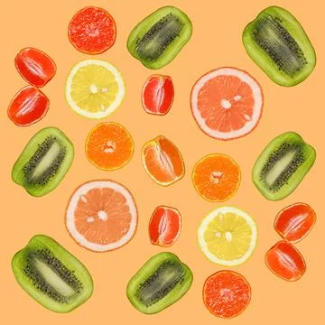 Seamless pattern with slices of orange, lemon, kiwi, grapefruit on an orange 写真素材