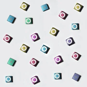 Seamless pattern with small multi-colored iPod Shuffle old music players 스톡 사진