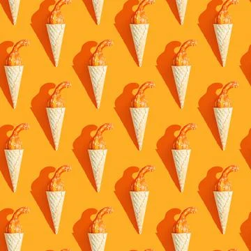 Seamless pattern. small pumpkin in a ice cream cone Stock Photos