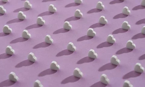 Seamless pattern of small white hearts on purple background Foto stock