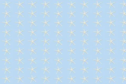 Seamless pattern of starfish on a blue background. Marine and nautical backgr Stock Photos