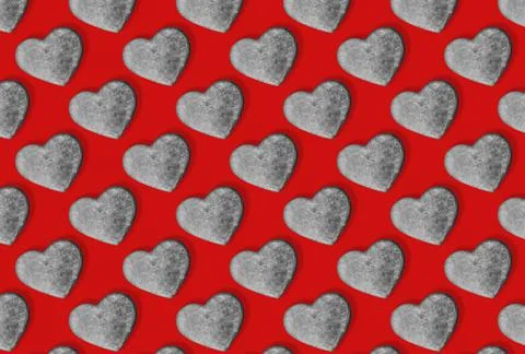 Seamless pattern with stone hearts on red. Stock Illustration