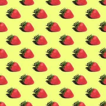 Seamless pattern of strawberries on a yellow background. Stock Photos