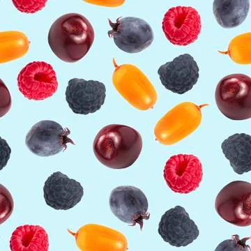 Seamless pattern. Sweet forest berries on a blue background. Top view, flat l Stock Photos