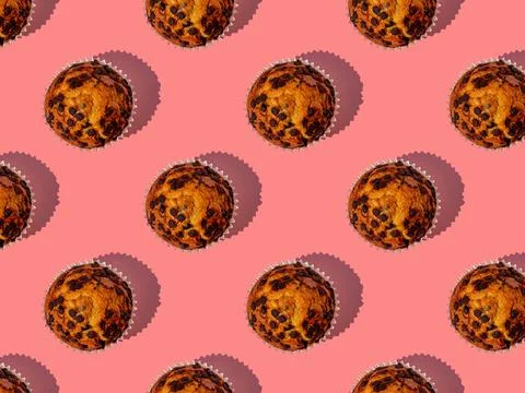 Seamless pattern of a tasty chocolate chip muffin. Stock Photos