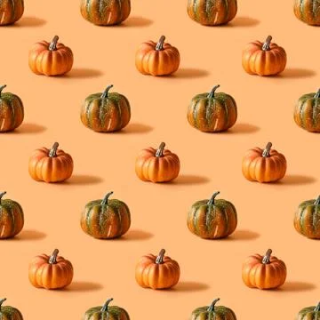 Seamless pattern of Thanksgiving day or Halloween pumpkin on orange backgroun Stock Photos