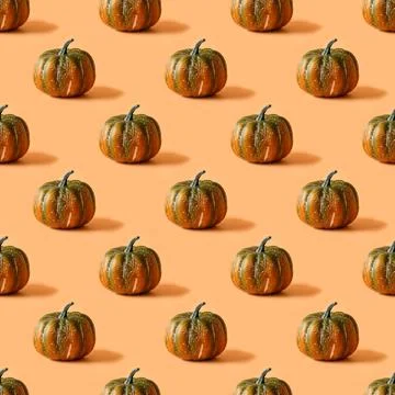 Seamless pattern of Thanksgiving day or Halloween pumpkin on orange backgroun Stock Photos