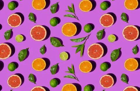 Seamless pattern of a top view of differrent half sliced citrus fruits and le Stock Photos