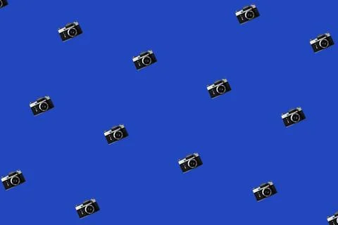 Seamless Pattern With Vintage Iinstant Camera on a Blue Background. Stock Photos