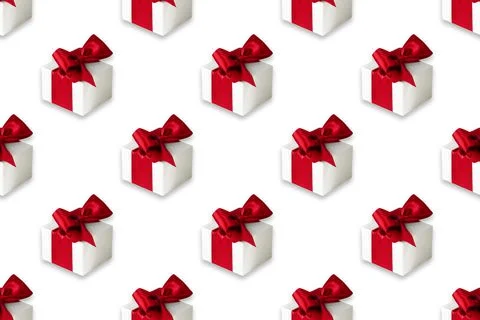 Seamless pattern on white background made of white gift boxes with red ribbon Foto stock