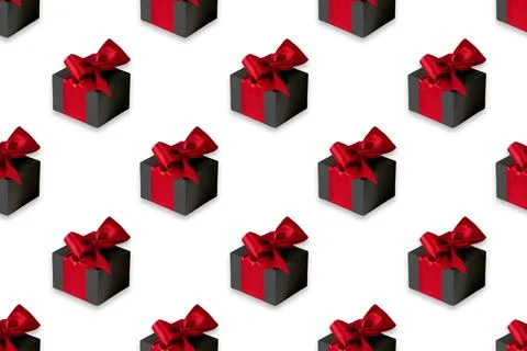 Seamless pattern on white background made of black gift boxes with red ribbon Stock Photos