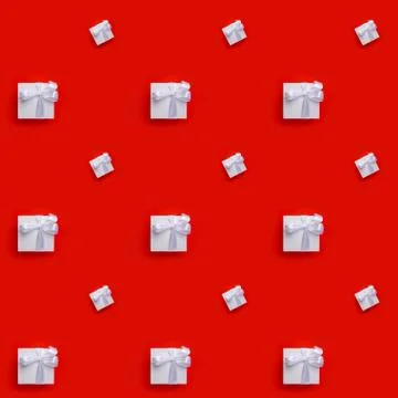 Seamless pattern of white boxes with gifts tied with ribbon on red background Stock Photos
