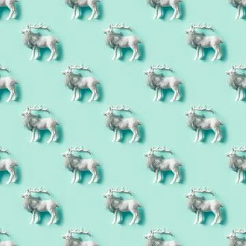 Seamless pattern of white Christmas deer on neo mint. Xmas . Foto stock