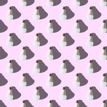Seamless pattern. white lightbulbs is down on pink background. geometric arra Stock Illustration