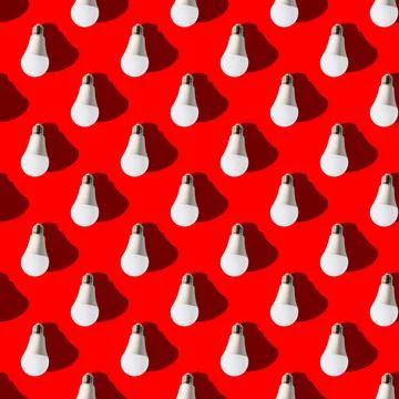 Seamless pattern. white lightbulbs is down on red background. geometric arran Stock Photos