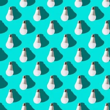 Seamless pattern. white lightbulbs is down on turquoise background. geometric Stock Photos