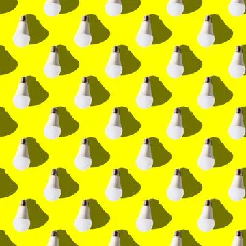 Seamless pattern. white lightbulbs is down on yellow background. geometric ar Stock Photos