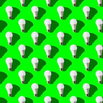 Seamless pattern. white lightbulbs is up on green background. geometric arran Stock Photos