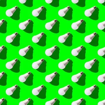 Seamless pattern. white lightbulbs is left down on green background. geometri Stock Photos